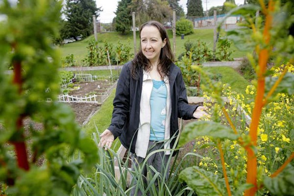 Blooming: Kathleen Somerville is co-chair of the New Westminster Community Garden Society, a non-profit organization that manages three community gardens in the city, including the Simcoe Park community garden pictured above.
