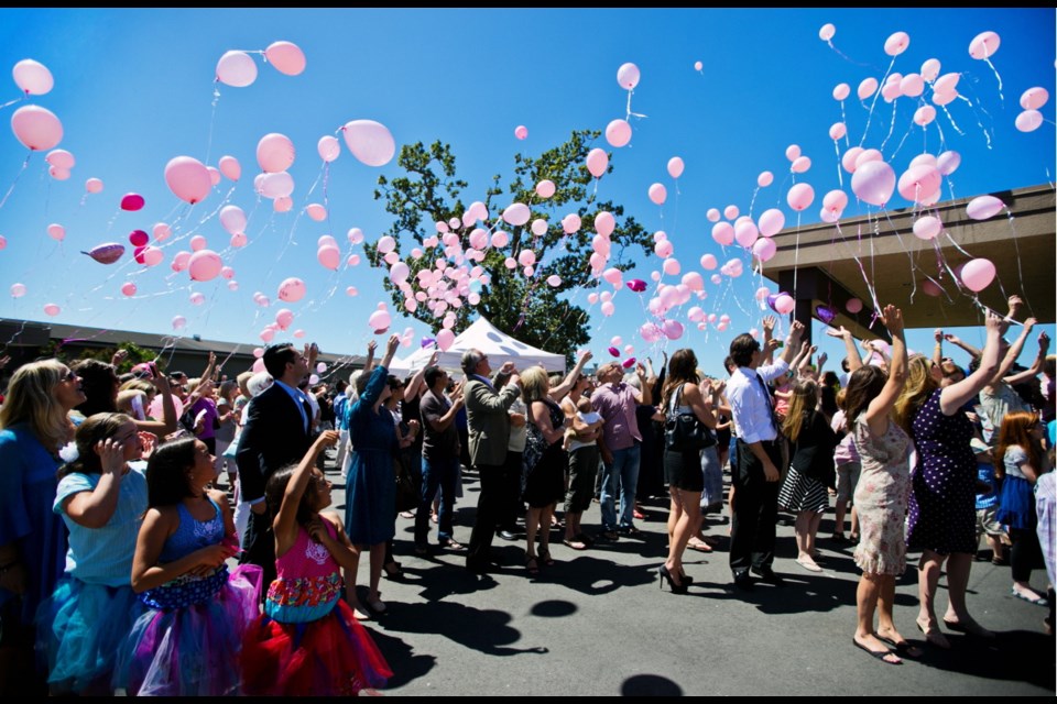 Family, friends and well-wishers release balloons Saturday in memory of Molly Campbell, who died July 10 after battling leukemia for more than two years.