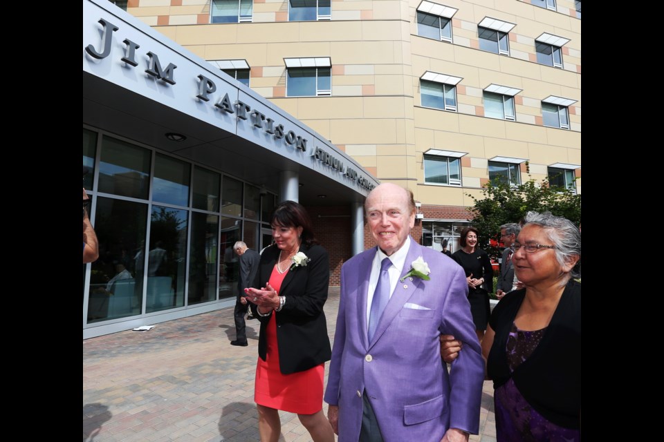 Leslee Farrell, donor Jim Pattison (center) and Maryann Thomas take part in the sign unveiling as the Victoria Hospitals Foundation announces the largest ever healthcare gift on Vancouver Island, and officially names the Royal Jubilee Hospital's Patient Care Centre.