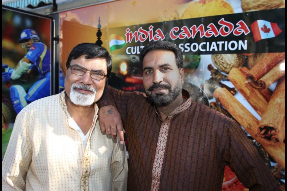 Sunil Bhatia with Jagir Virk at the India Canada Cultural Association booth.