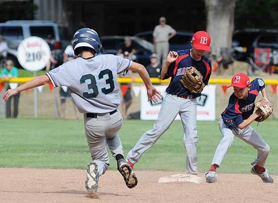 Hastings' Nicolas Santarelli is thrown out at first base in a 12-9 loss to White Rock at Elm Park July 24.