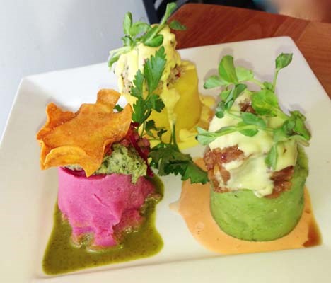 Chicha's colourful causa dish includes Cangrejo (piquant crab salad with avocado, mango and aji amarillo), Atün (albacore tuna with whipped cilantro potato, passion fruit ponzu and wasabi cream and Verduras (lima beans and black mint over purple beetroot puréed potato).