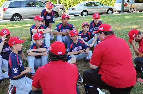 Hastings Little League manager Vito Bordignon holds the attention of the All-stars after winning the semifinal July 27 to advance to the championship game. They lost the final to White Rock.