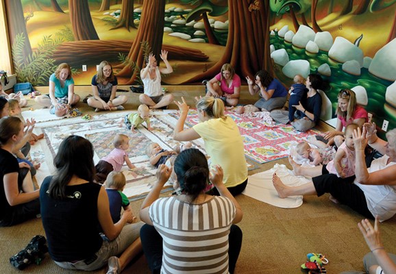 Families with babies and toddlers have fun during Mother Goose and More at Lynn Valley Library July 24. Libraries run programs for kids through the summer.