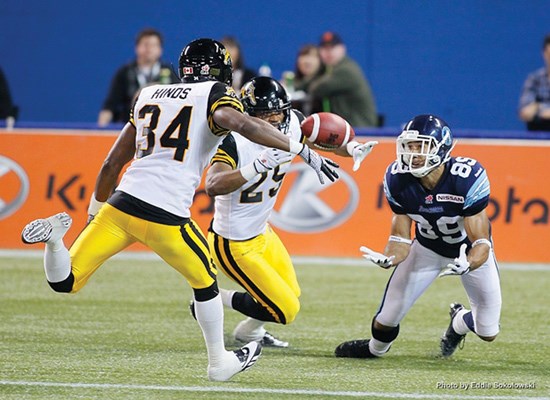 Spencer Watt hauls in a touchdown pass. The multi-talented Windsor secondary grad kicked the convert for his own TD, helping the Argos to a big win.