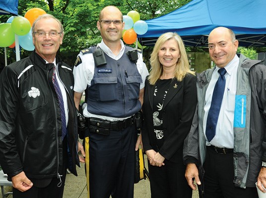 Neptune Terminals president Jim Belsheim and CFO Gonzalo Benitez flank Insp. Dave Attfield and Louise Ranger