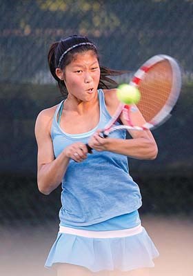 The return: Jenny Fu shows intense concentration despite a 6-3, 6-3 loss to eventual women's 4.5 singles champion Andrea Frustaci in a semifinal match at the Burnaby Open tennis championships last Friday.
