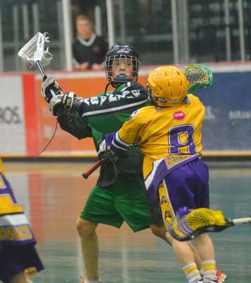 Jack's boys: Burnaby's Kevin Oliver, in green, gets a pass off in a Tier 1 game against eventual champion Coquitlam at the Jack Crosby Memorial novice all-star lacrosse tournament.