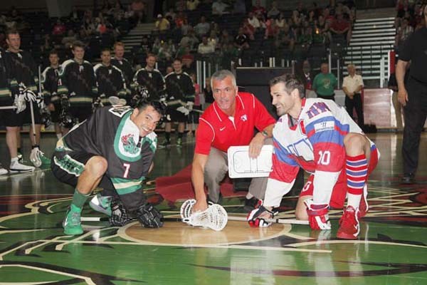 Nine time: Russ Heard, centre, takes a ceremonial faceoff at his jersey retirement night on July 5.