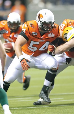North Vancouver's Dean Valli clears the way for his running back in a recent game against the Edmonton Eskimos. Valli is back in the starting lineup for the BC Lions after recovering from a pair of leg injuries.