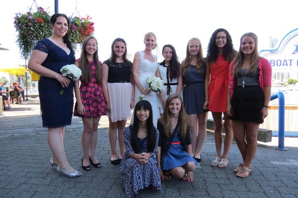 Jill Burpee and Josh Denman had a special wedding reception thanks to the New Westminster peewee girls softball team.