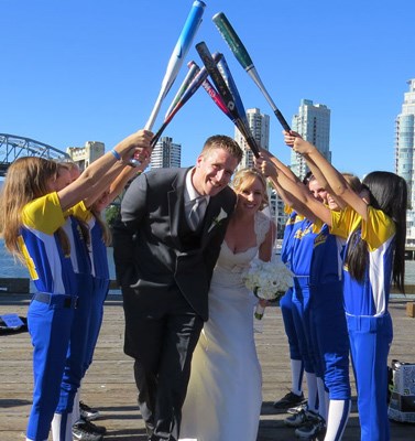 Jill Burpee and Josh Denman had a special wedding reception thanks to the New Westminster peewee girls softball team.