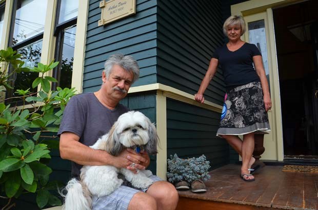 Missing greeter: Steve and Gail North and dog Benny are missing their gargoyle, Al, who used to live on the front porch of their Fourth Street home. The two-foot-high gargoyle disappeared on Aug. 5 after living undisturbed on the porch for more than two years.