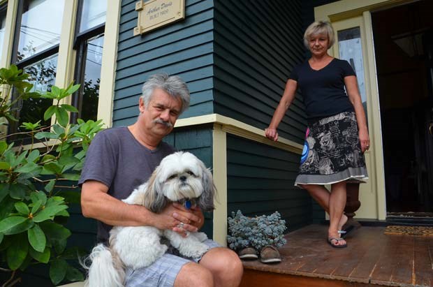 Missing greeter: Steve and Gail North and dog Benny are missing their gargoyle, Al, who used to live on the front porch of their Fourth Street home. The two-foot-high gargoyle disappeared on Aug. 5 after living undisturbed on the porch for more than two years.