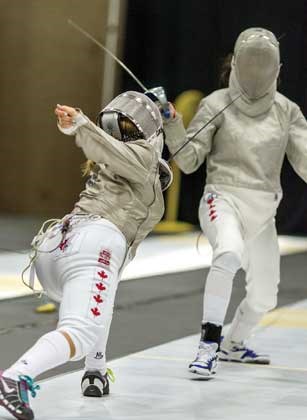 North Vancouver’s Zoe Clarke (left) strikes a slashing blow with her sabre during the Canada Summer Games last week in Sherbrooke, Que.