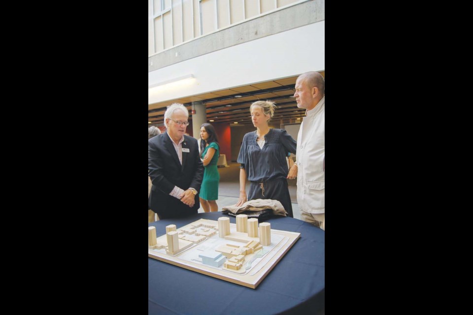 Chip and Shannon Wilson (right) discuss the design with Alan Davis.
