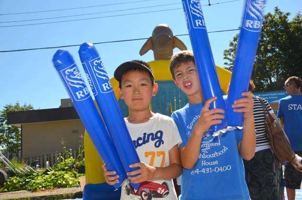 Building community: Roya Nari and Zofia Faryad mug for the camera at the South Burnaby Neighbour-hood House street party on Aug. 8.