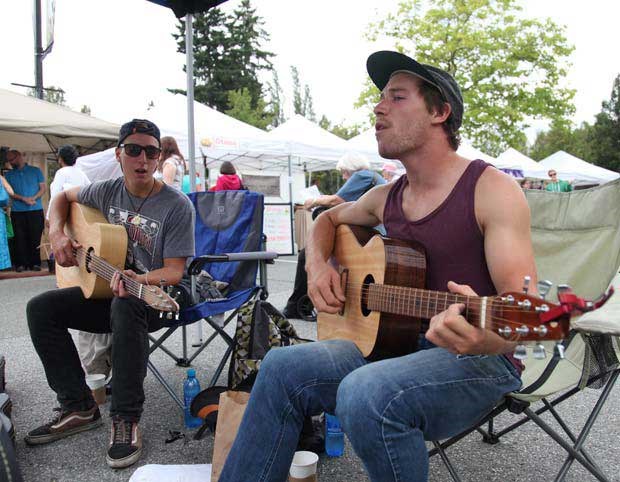 Jordan Araki, left, and Oscar Graham participated in the great zucchini races event at the Burnaby Farmers' Market on Aug. 17. The duo built their own vegetable speeders using locally grown produce.