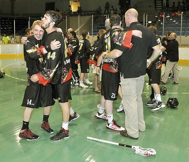 The thrill of victory: Minto Cup MVP Dan Lintner, left, congratulates a teammate following the team's 10-8 win in overtime over the New Westminster Salmonbellies in the Canadian junior A national championship title game at Queen's Park Arena on Sunday.
