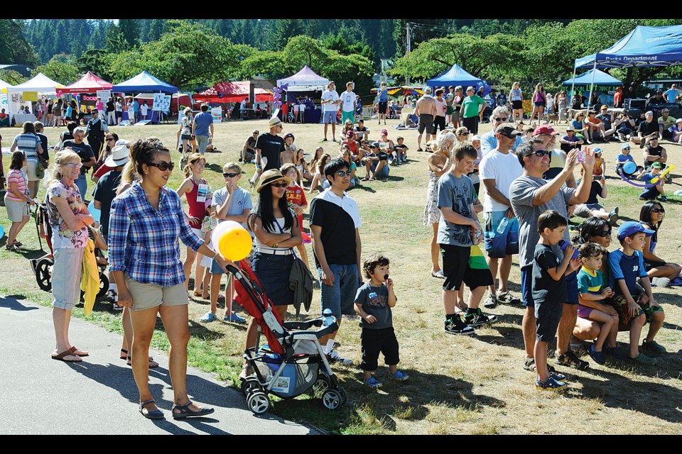 The crowds begin to build as bands play on the main stage during the annual festival.
