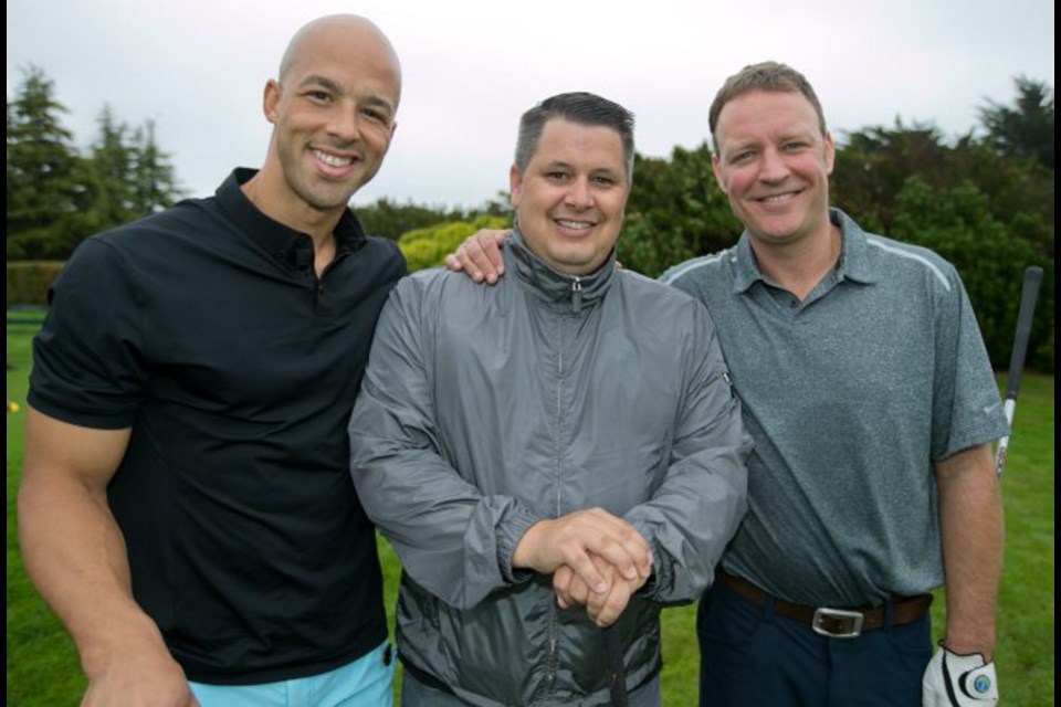NHL free agent Manny Malhotra, left, with Power To Be board member Tim Quocksister and founder Tim Cormode.