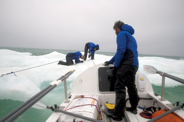 Crew members on the Arctic Joule struggle to anchor the rowboat to the ice. Scan this photo with the Layar app to see more photos and video from the expedition.