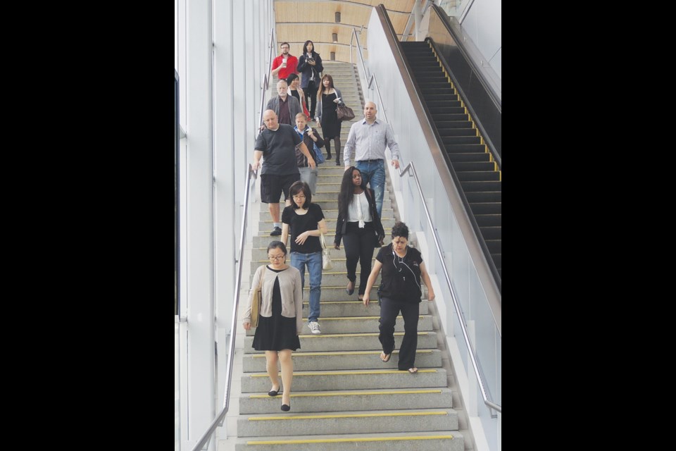 To the naked eye, Ron Diaz, striped shirt, and Dave Thomson, shorts, look like everyone else on a crowded train station stair. What people don't see are two men who've dealt with serious health problems that are invisible to all but those close to them.