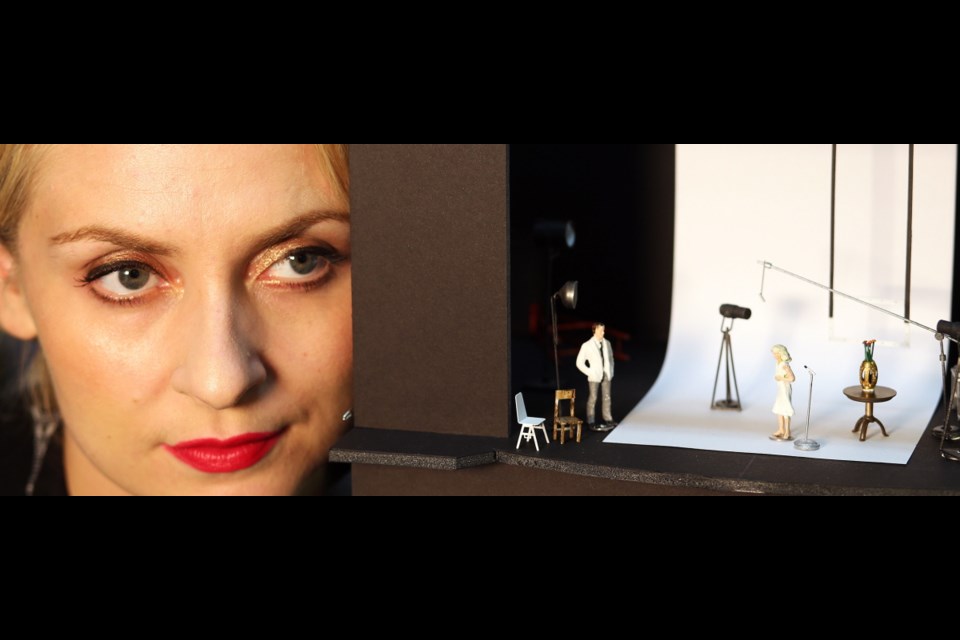 Singer Eivor Palsdottir stars as Marilyn Monroe in the new Gavin Bryars opera, Marilyn Forever. In this photo, she is posing beside a model of one of the sets.