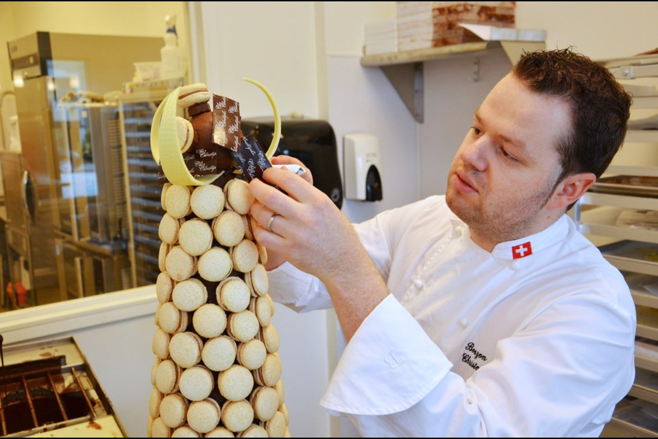 Christophe Bonzon, owner of Chez Christophe Chocolaterie Patisserie, uses Swiss chocolate to create sculptures in his shop.