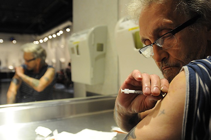 Larry Love, 62 injects heroin. Photo Dan Toulgoet