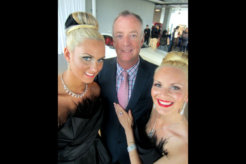 Dripping in diamonds, models Kate Saunders and Holly Graham, flanked Luxury and Supercar founder Craig Stowe.