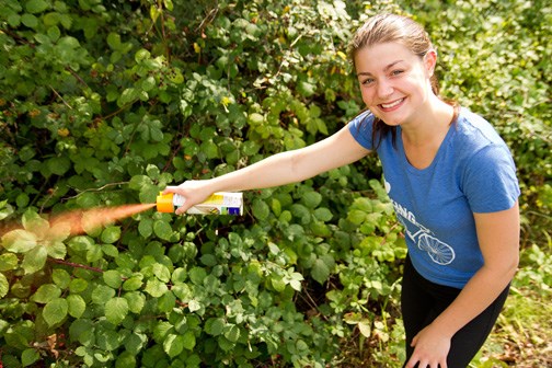 Too invasive: Jaycee Clarkson, a member of New Westminster Environmental Partners, sprays blackberry bushes for the invasive plant pull that will take place during the Shoreline Cleanup taking place in Queensborough on Sept. 22. The event is the kickoff to RiverFest.