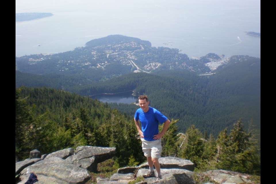 Mike Hanafin standing on Eagle Bluff with Horseshoe Bay below.