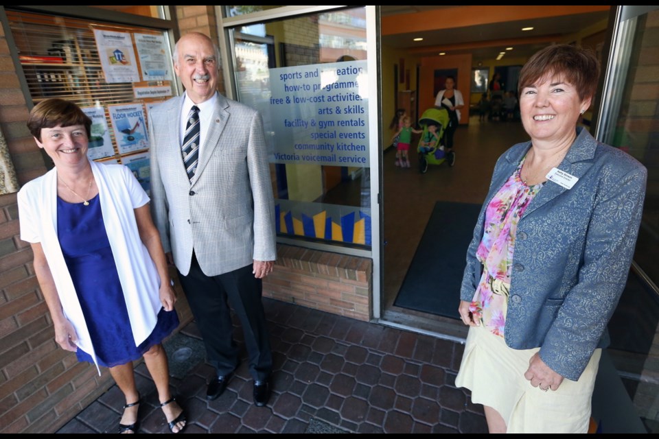 Rosalind Scott, left, and Murray Robinson from the Rotary Club of Victoria and the Cool Aid Society&Otilde;s Kathy Stinson in the renovated foyer area at the the Downtown Community Centre.