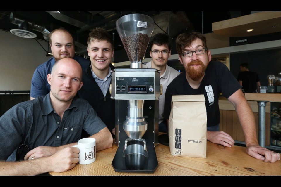 From left, Camosun students Justin Napier, Peter Rashleigh, Taylor Simpson and Forrest Trenaman display their Cronus Espresso grinder with Sam Jones, owner of 2% Jazz coffee company in the Hudson Building. The water-cooled machine lessens "cooking" during grinding, keeping flavour.