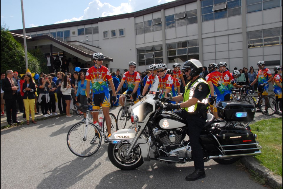 The Cops for Cancer participants in the Tour de Coast stopped by Alpha Secondary on the first day of their nine-day bike tour to raise money for cancer research and support.