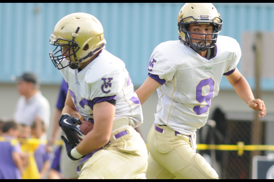 Vancouver College running back Robbie Welch (No. 33) takes a hand-off from Giordy Belfiore (No. 9) in a 34-35 loss to the Handsworth Royals Sept. 19 at Handsworth. Welch set a new school record with a 87-yard touchdown run.