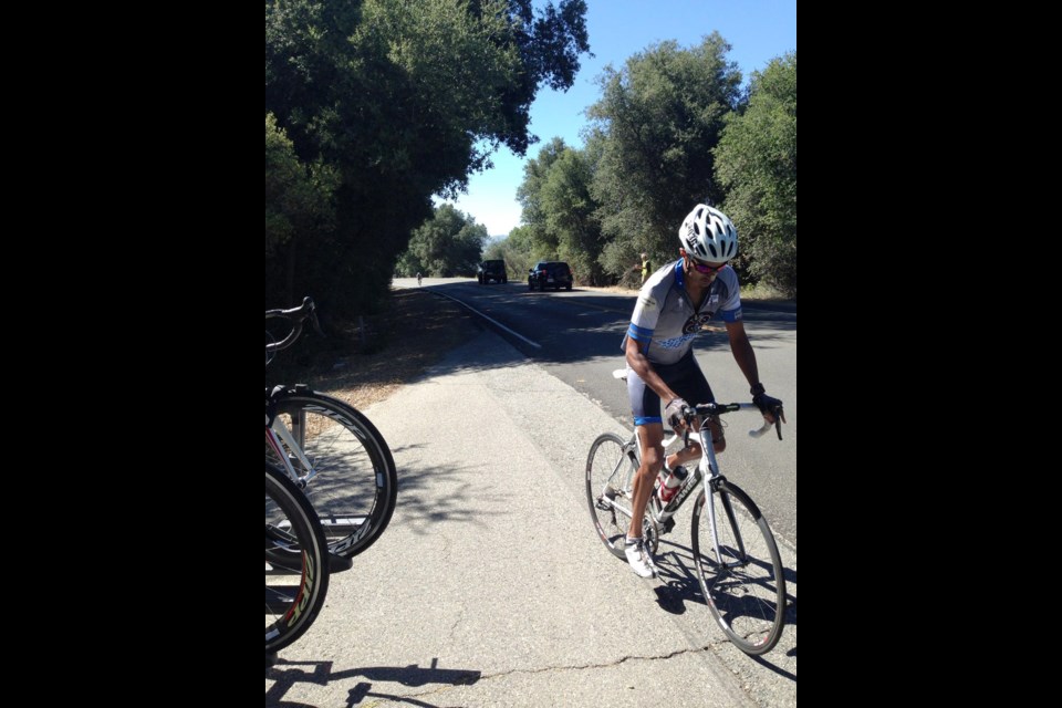 Climbing: Yati Yadav treks along the side of the road during the 5,000 kilometre Ride Across America. The ride was in support of Barrow Neurological Institute, a medical facility in the United States that specializes in treating patients with brain and spinal tumors.