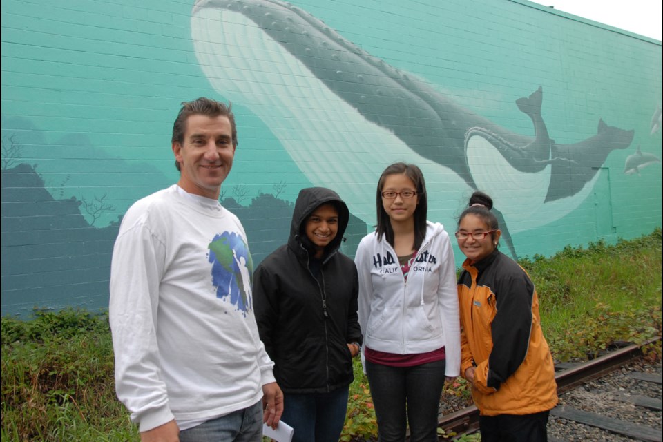 Connecting the Pacific: From left, mural artist Todd Polich was joined by Aishwi Roshan, Wendy Tsai and Roya Nari at the Connected Oceans mural unveiling on Sept. 29 in the Kingsway-Imperial neighbourhood.