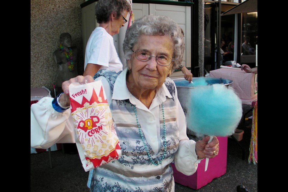 Treats galore: Bruna Pavey enjoyed some of the treats offered at the Kiwanis Care Centre carnival on Sept. 12, including cotton candy and popcorn.