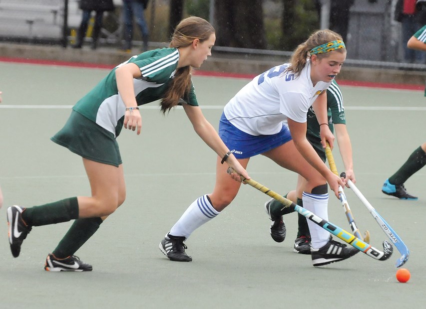 Argyle's Christina Stewart (left) chases Handsworth's Emily Martin during a North Shore AAA league game Tuesday at Rutledge Field. Handsworth, the defending AAA provincial champs, won 2-0.