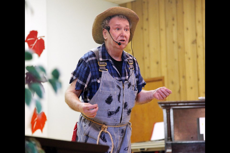 In the spotlight: Dan Minor performs at the Seniors Have Talent! show at Sapperton Pensioners Hall on Oct. 5. Minor won second place for his renditions of Old Man River and Smile.
