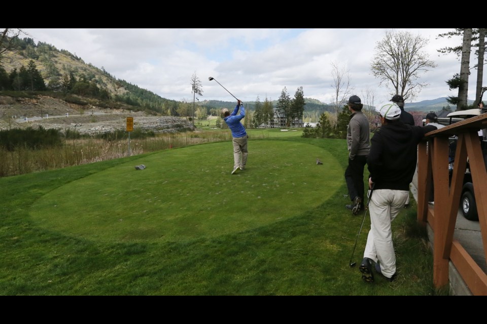 Golfers on the course at Bear Mountain resort.