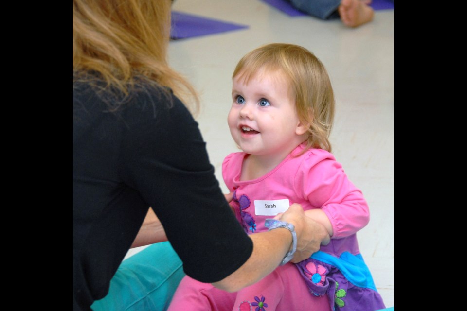 Fun with mom: Sarah McPherson, aged 20 months, plays with mom Jennifer McPherson during Toddler's First Dance class at Cameron Rec Centre.