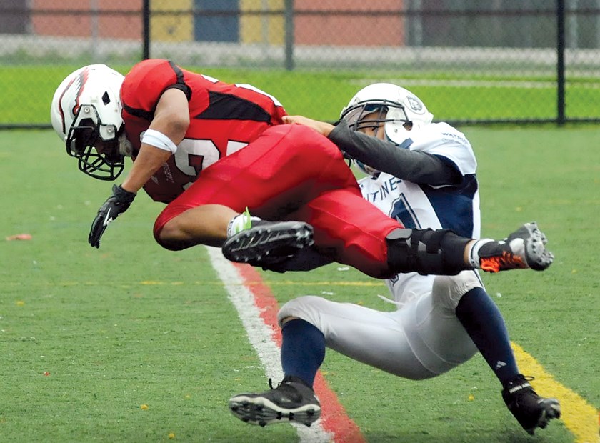 Carson Graham running back A.J. Blackwell gets wrestled down by a Sentinel tackler during a AA matchup Oct. 4. Blackwell racked up 179 yards and two touchdowns in just eight carries as the Eagles romped to a 70-0 win over the fledgling Sentinel senior team.
