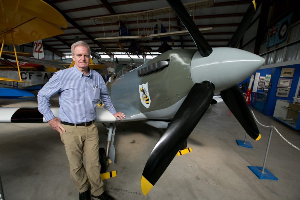 British Columbia Aviation Museum president Stephen Gordon with a replica of a Spitfire.