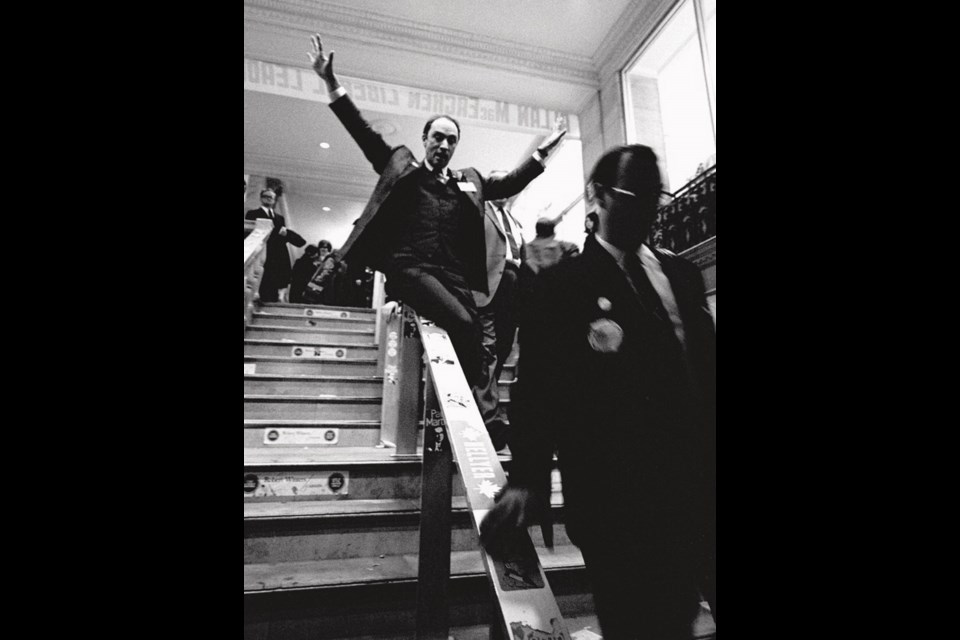 Pierre Trudeau slides down the banister at the 1968 Liberal convention.