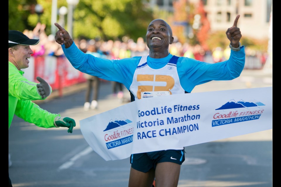 Lamech Mokono, a native of Kenya who lives in Santa Fe, N.M., breaks the Victoria men's marathon record with a time of 2:13:42.