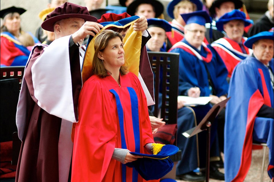 Honoured: Gordon Myers, associate vice-president of academics, drapes a sash over Christine Sinclair’s head. Sinclair was awarded an honorary doctorate of laws from Simon Fraser University.