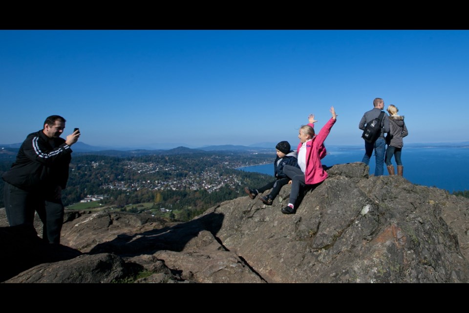 Mount Douglas summit draws families, hikers, runners and cyclists for views over the capital region.